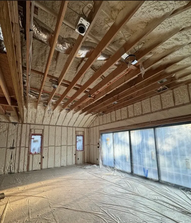 Interior walls and ceiling insulated with spray foam during new construction in Crestwood